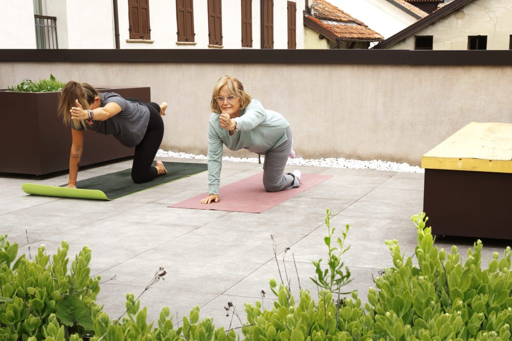 Old woman doing fitness exercises